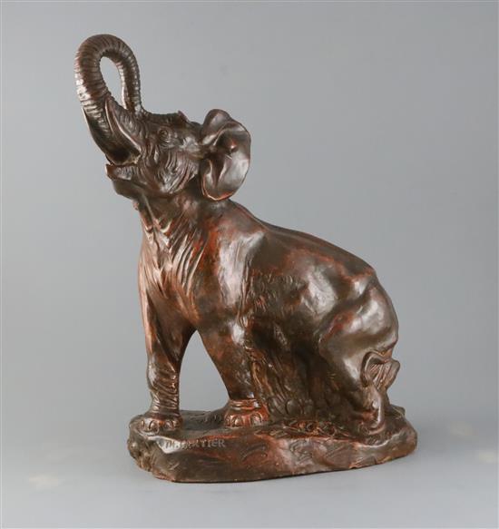 Thomas Francois Cartier (French, 1879-1943). A bronzed terracotta model of an elephant standing with raised trunk, H.17in.